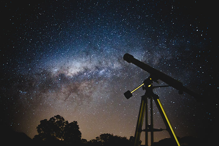 Telescope under a starry night sky, inviting exploration of fun hobbies in astronomy.