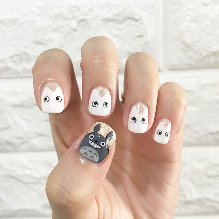 Totoro inspired nail art design showcasing imaginative hobby creativity.