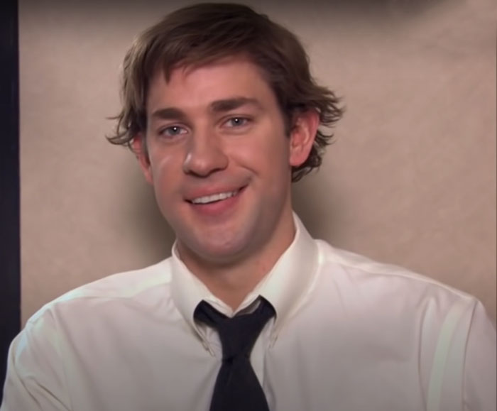 Jim Halpert wearing a black tie and white shirt 