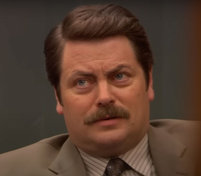 Ron Swanson wearing brown suit 
