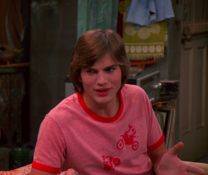 Michael Kelso wearing red t-shirt 