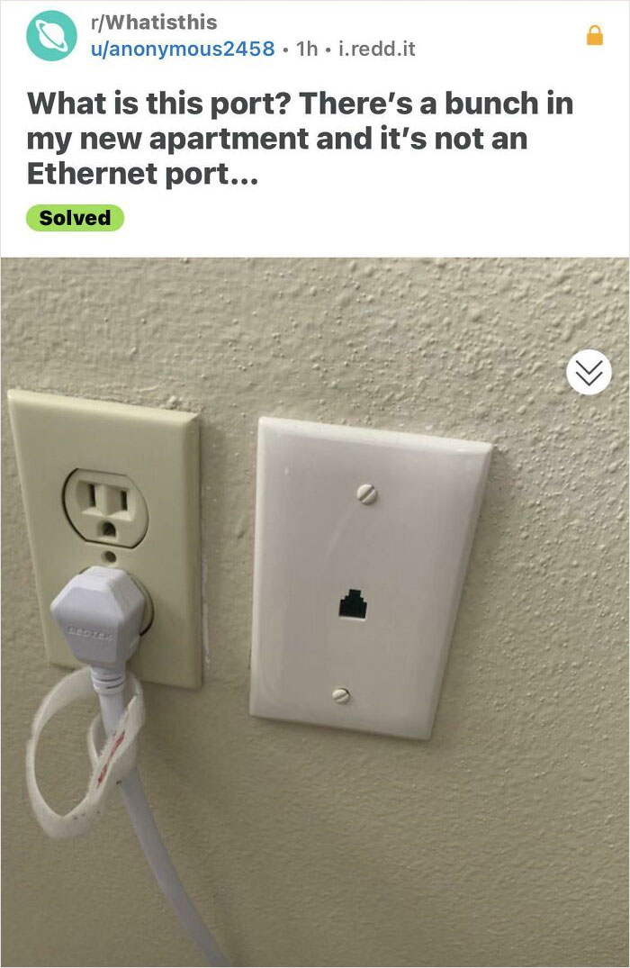 Outlet and unidentified port photographed with the question, "What is this port?" visible above.