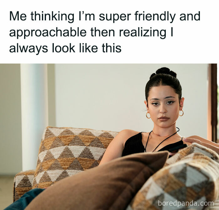 Woman with a humorous caption on a couch, embodying a "spicy meme" theme for a lighthearted mood boost.