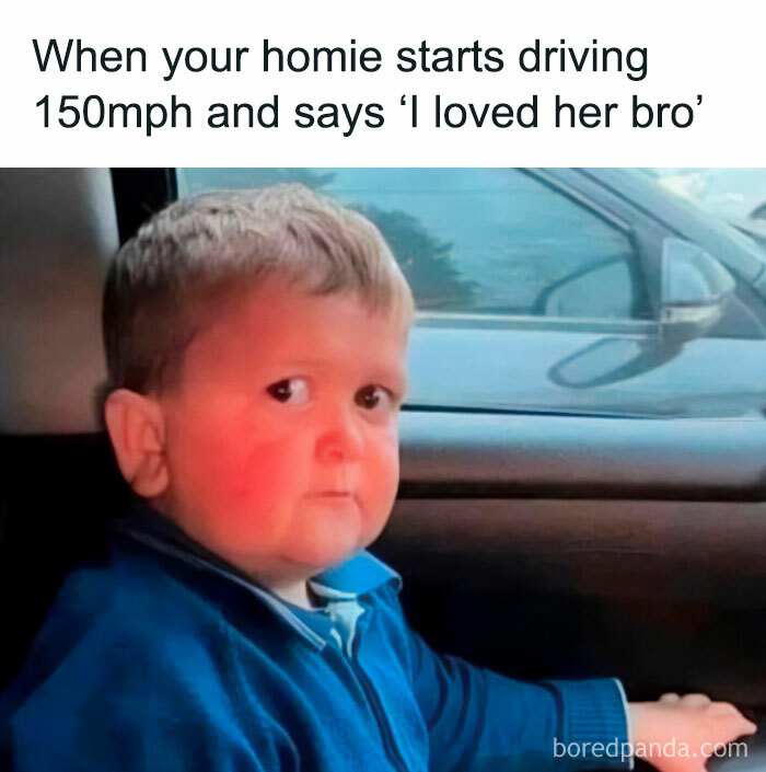 A boy with a concerned expression sits in a car, capturing a relatable spicy meme moment.
