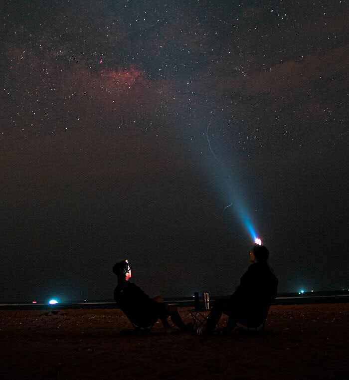 Friends Looking At Stars In Night 