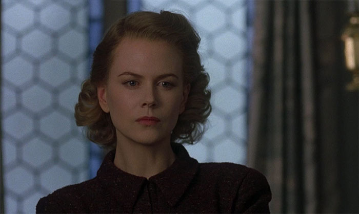 Mrs. Mills wearing a black jacket 