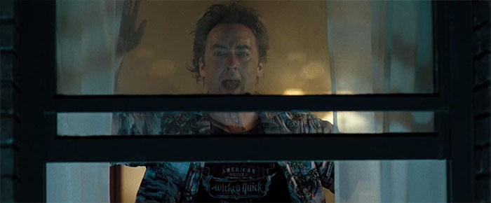 Mike screaming while looking out of the window 