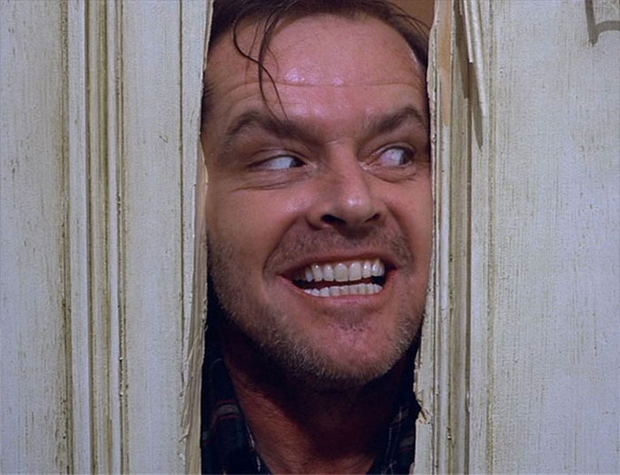 Jack looking throughout the hole in the door 