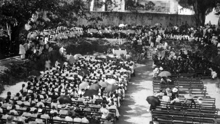 Large Group Of People Waiting For An Outdoor Baptism To Begin. Shantou, Guangdong, China