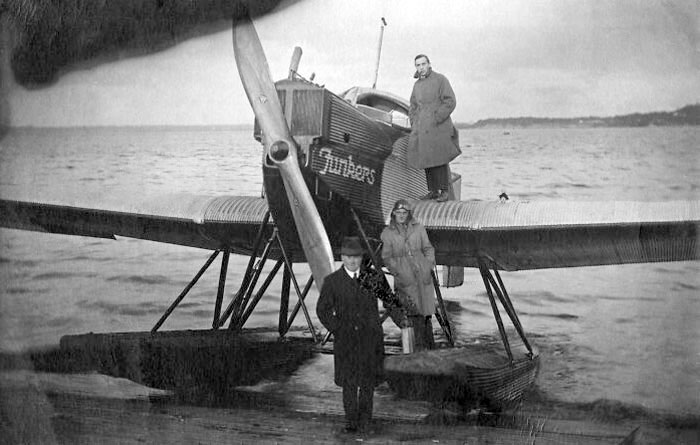 Photographer Constantin Grünberg Stands On The Wing Of An Airplane On The Beach Of Katajanokka On The Way To Tallinn