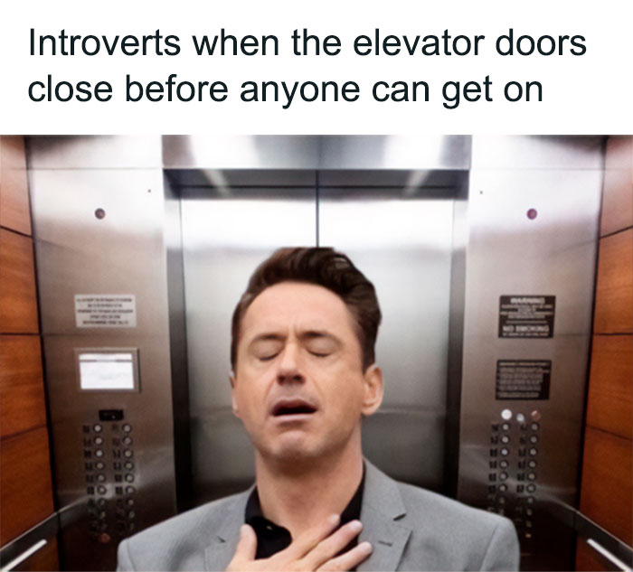 A relieved introvert in an elevator, eyes closed, as doors close before others can enter.