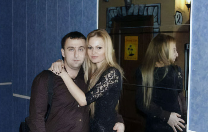 Scary mirror reflection of a man and a woman face as the same 