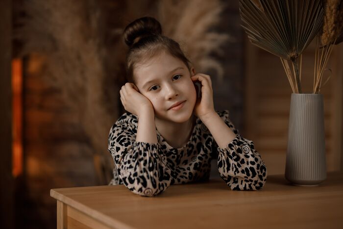 Kid sitting and looking