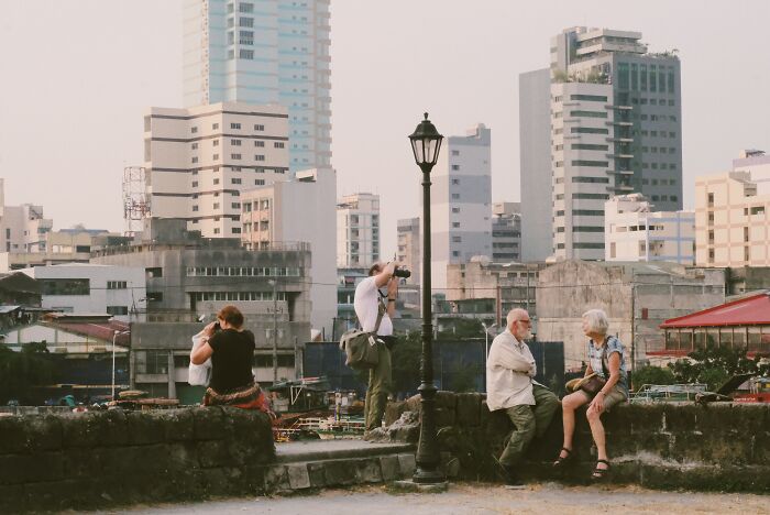 Persons taking photos of strangers