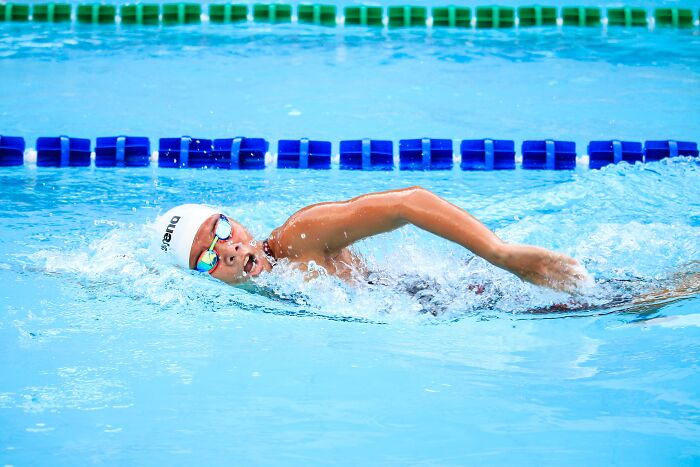 Man Swimming In The Swimming Pool 