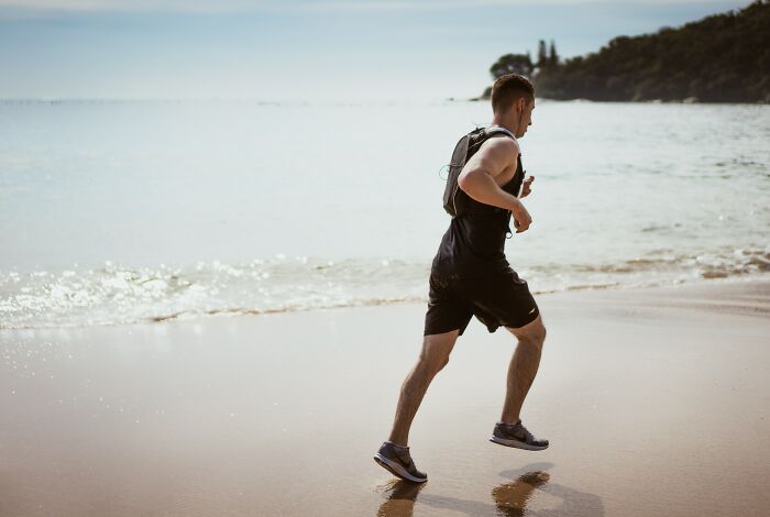 Man Running On Beach 
