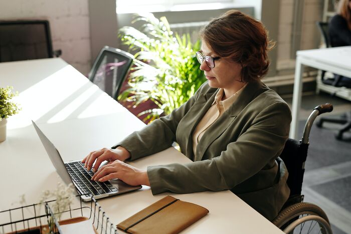 Woman Typing On The Laptop