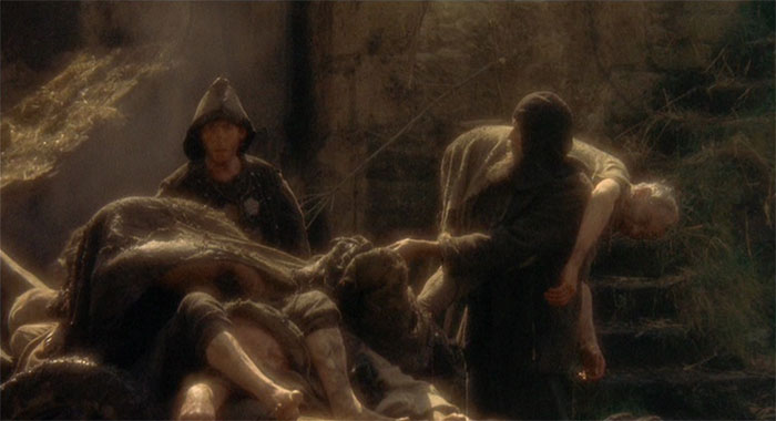 The Dead Collector carrying bodies