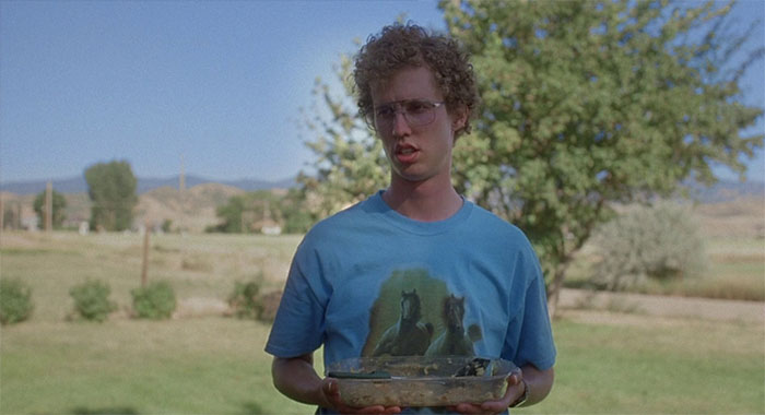 Napoleon Dynamite holding empty bowl