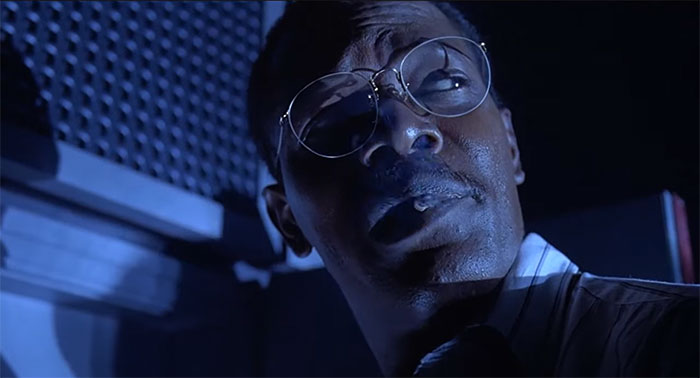 Ray Arnold smoking a cigarette