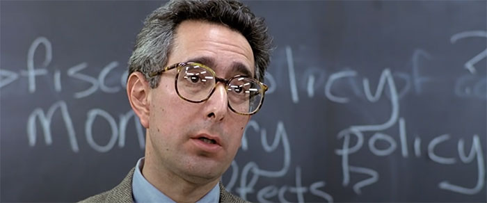 Economics Teacher talking