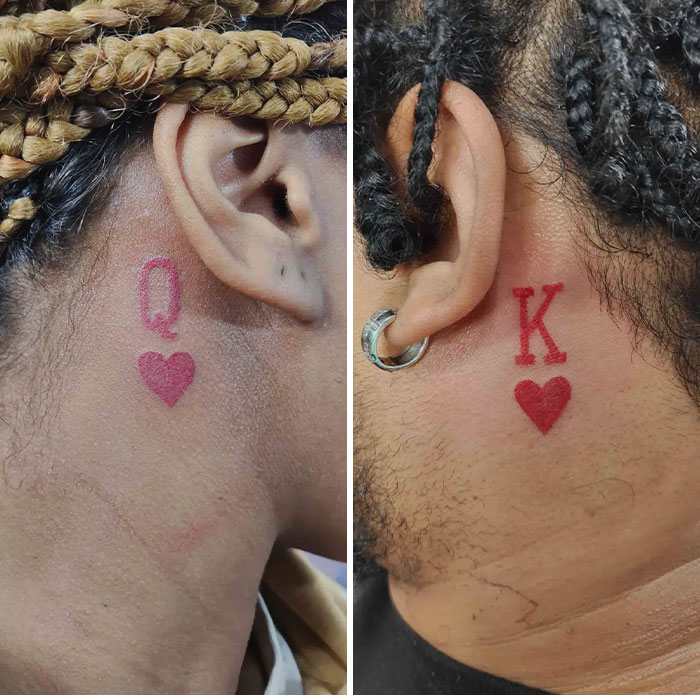 Red ink tattoos of a 'Q' and 'K' with hearts behind ears, showcasing creative tattoo design ideas.