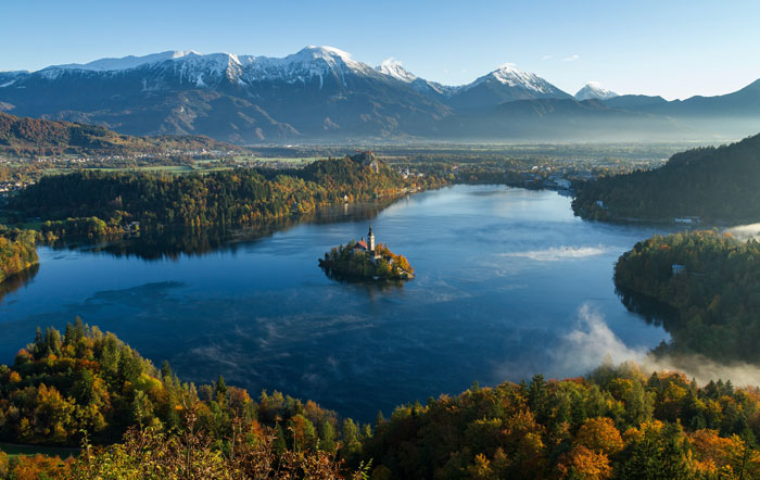 Slovenian mountains with a snow on the top of them 