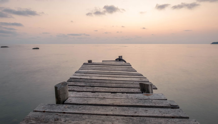 wooden bridge into the sea