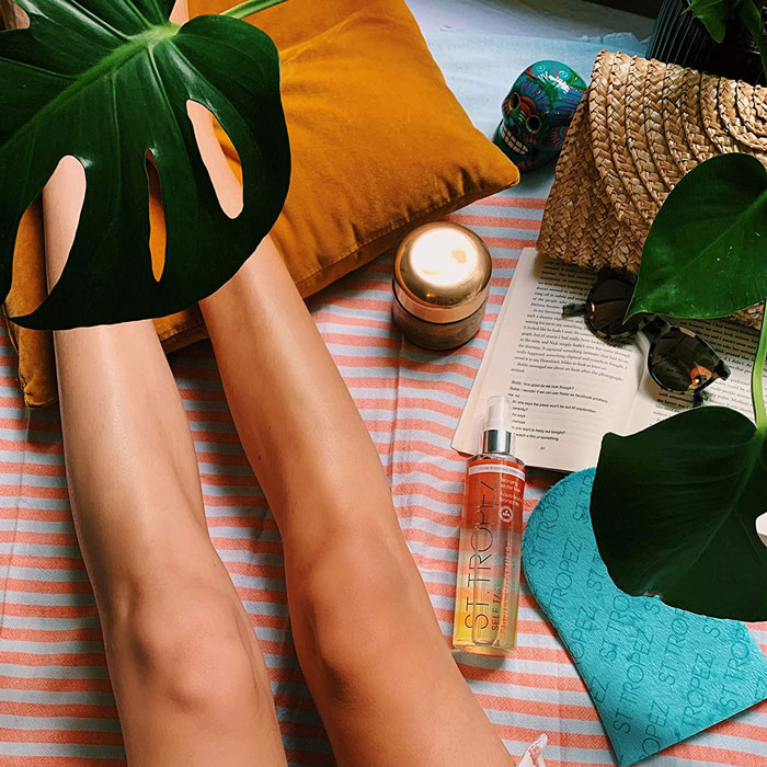 Female legs on the towel 