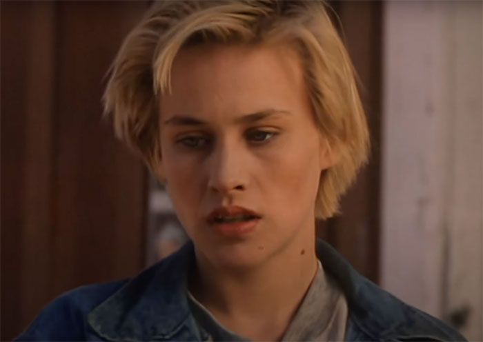 Erika standing and looking in Tales from the Crypt