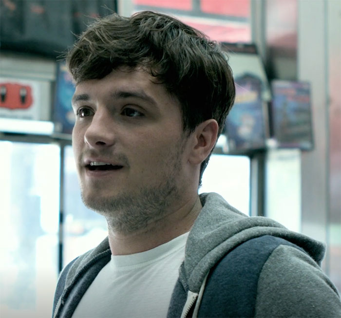 John standing and looking in Future Man