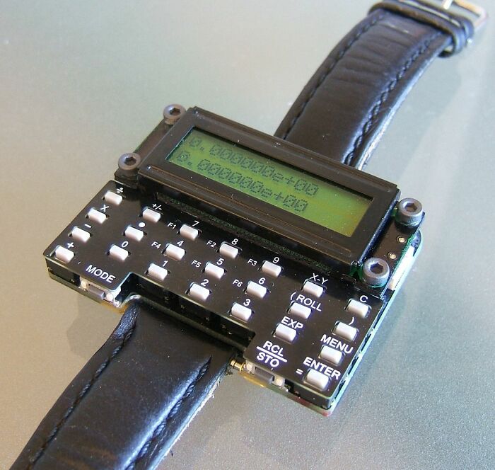 Retro digital wrist calculator with monochrome screen and black leather strap, showcasing old gadgets trendsetters technology.