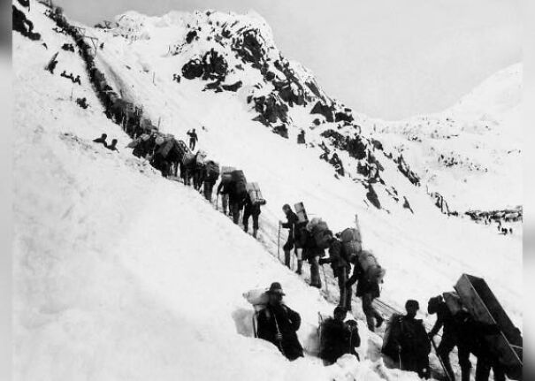 Gold diggers climb Chilkoot pass in Alaska, 1898.