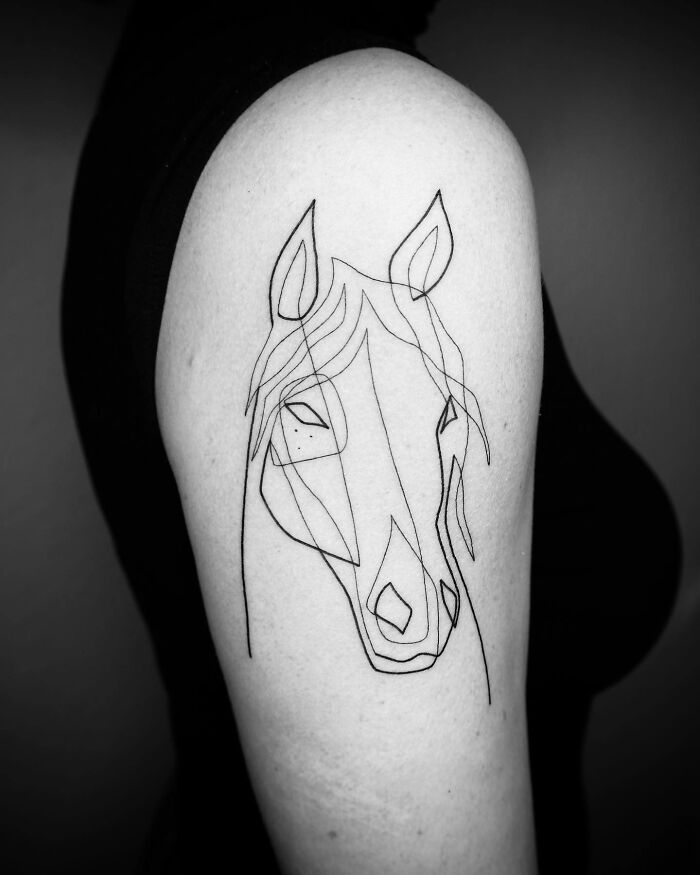 Single line tattoo of a horse on an arm, showcasing captivating artistic design.