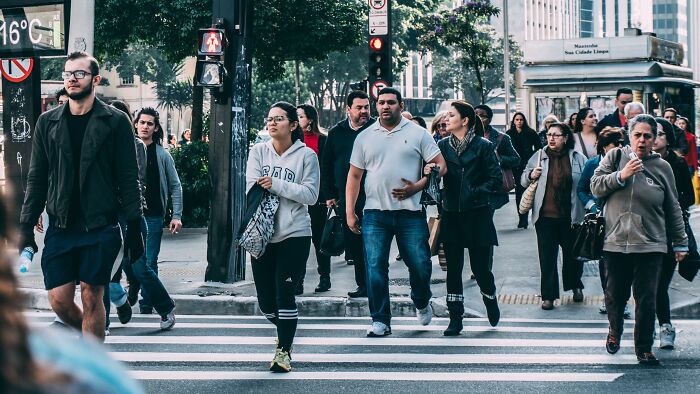 A group of people crossing the road 