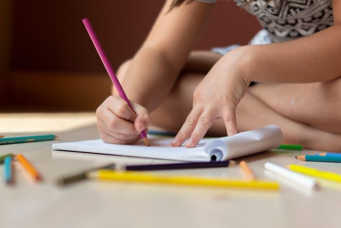 A kid drawing something 