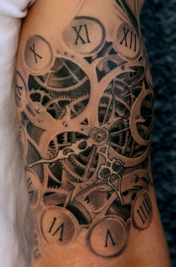 Optical illusion tattoo featuring intricate gears and Roman numerals, creating a mind-bending design on the arm.