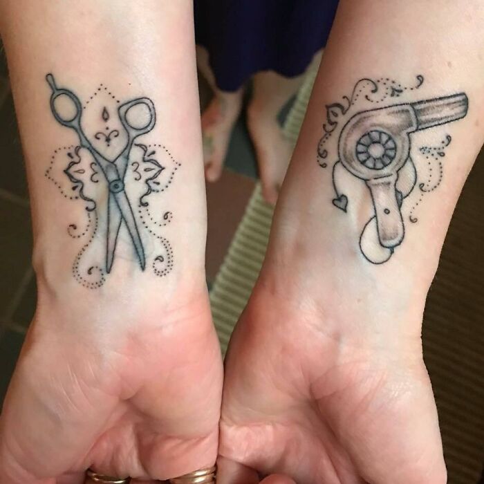 Scissors and hairdryer wrist tattoos showcasing stylish, creative designs.