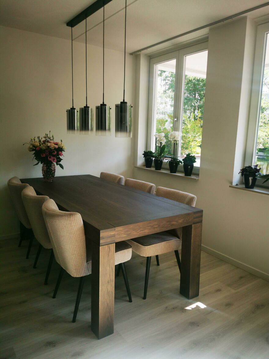 Brown table and white chairs 