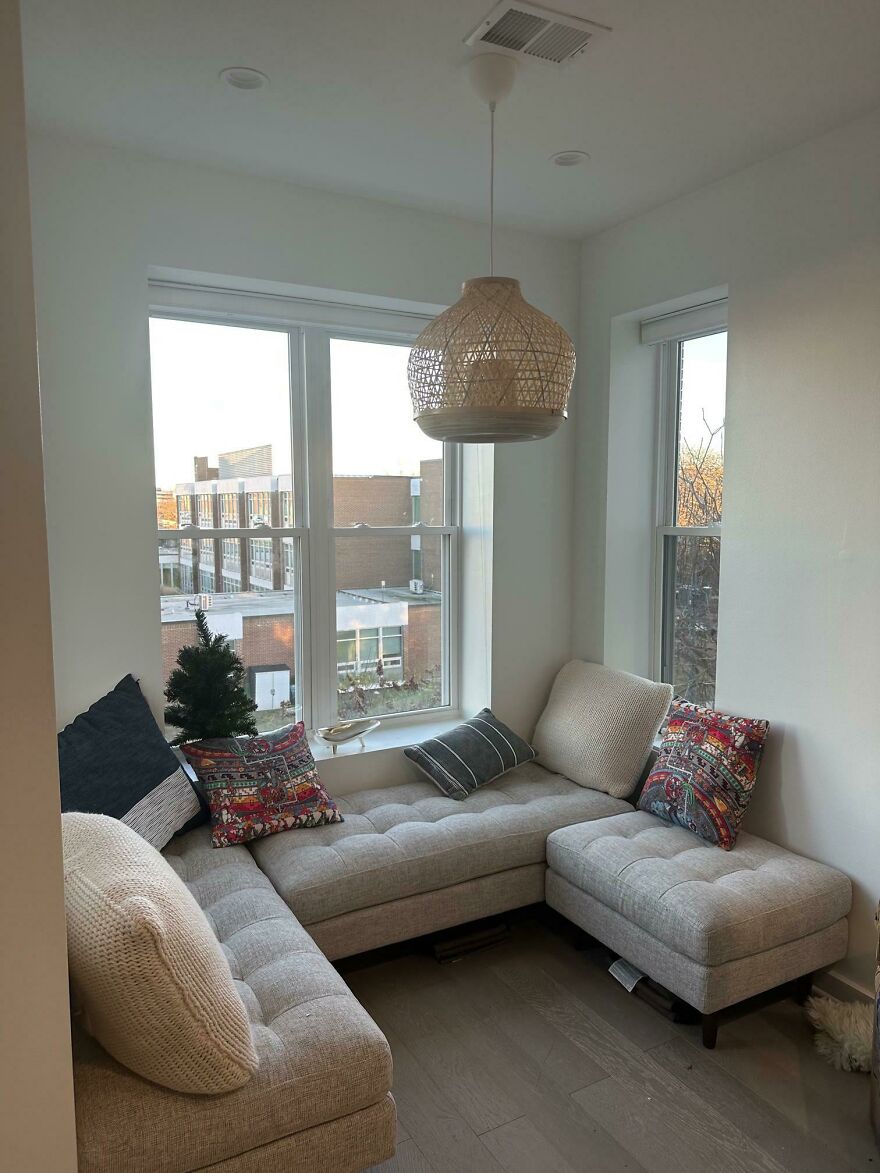 Grey couch in the white living room 