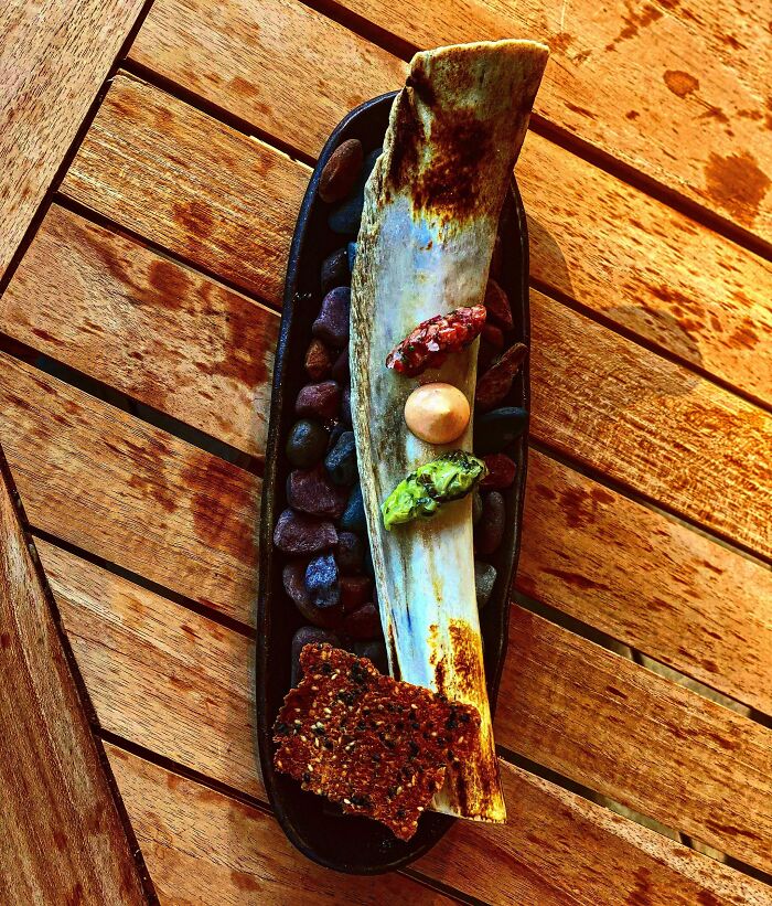 Hokkaido A5 & House Beef Bacon Tartare. Smoked Beef Fat Special Sauce. Fermented Little Gem And Pickled Ramps. Burger Bun Cracker