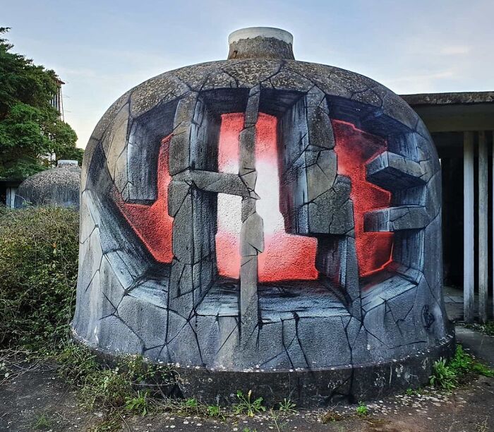 3D graffiti art on a concrete structure with c*****d stone illusion and red glowing background, creative graffiti art outdoors.