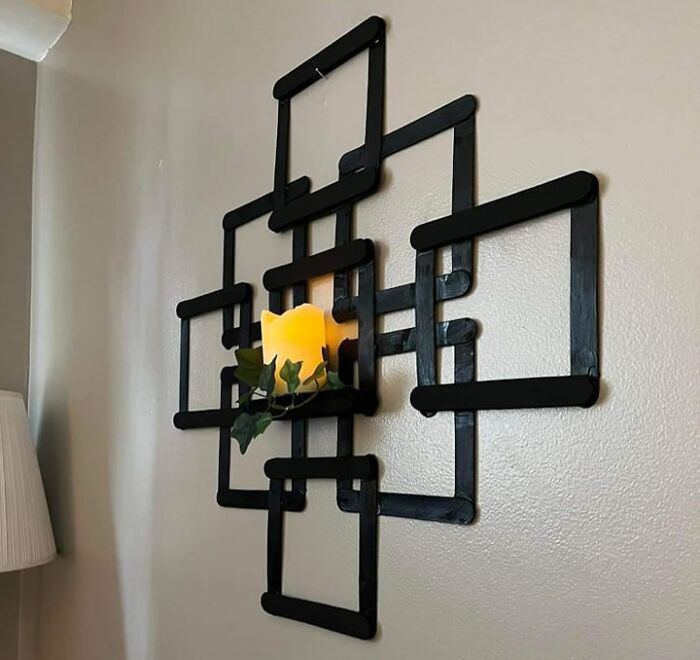 This Messy Popsicle Stick Wall "Art" Is Giving Children's Craft Vibes