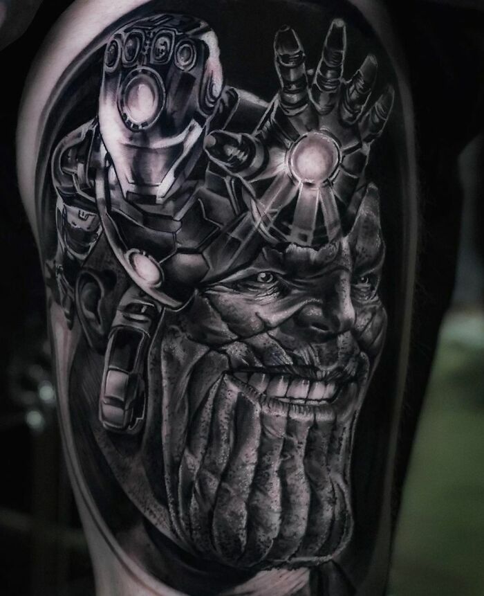 Marvel tattoo featuring Thanos with the Infinity Gauntlet, showcasing intricate black and grey detailing.