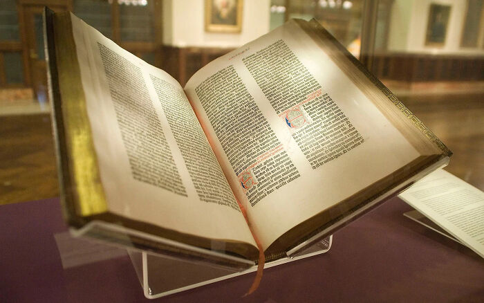 The Gutenberg Bible opened book behind the glass 