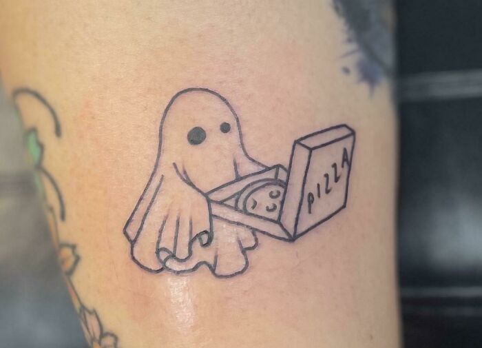 Ghost delivering pizza tattoo, combining food art in a playful design.