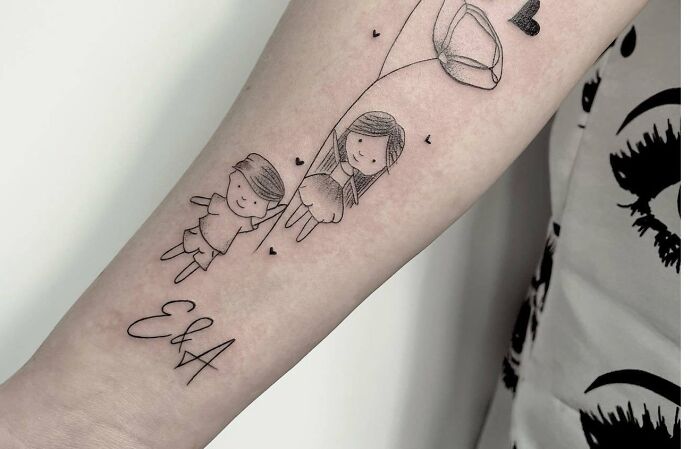 Cute mother-child tattoo with children holding balloons and initials "E & A" on a person's forearm.
