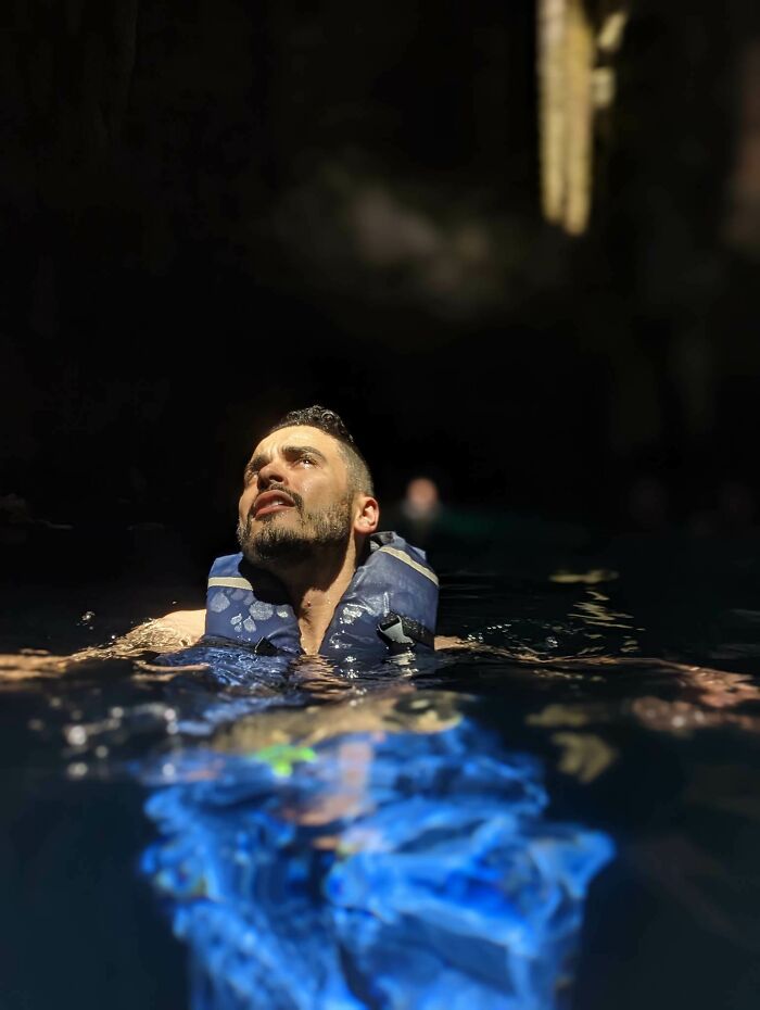 Sunlight Strikes Man In Cenote