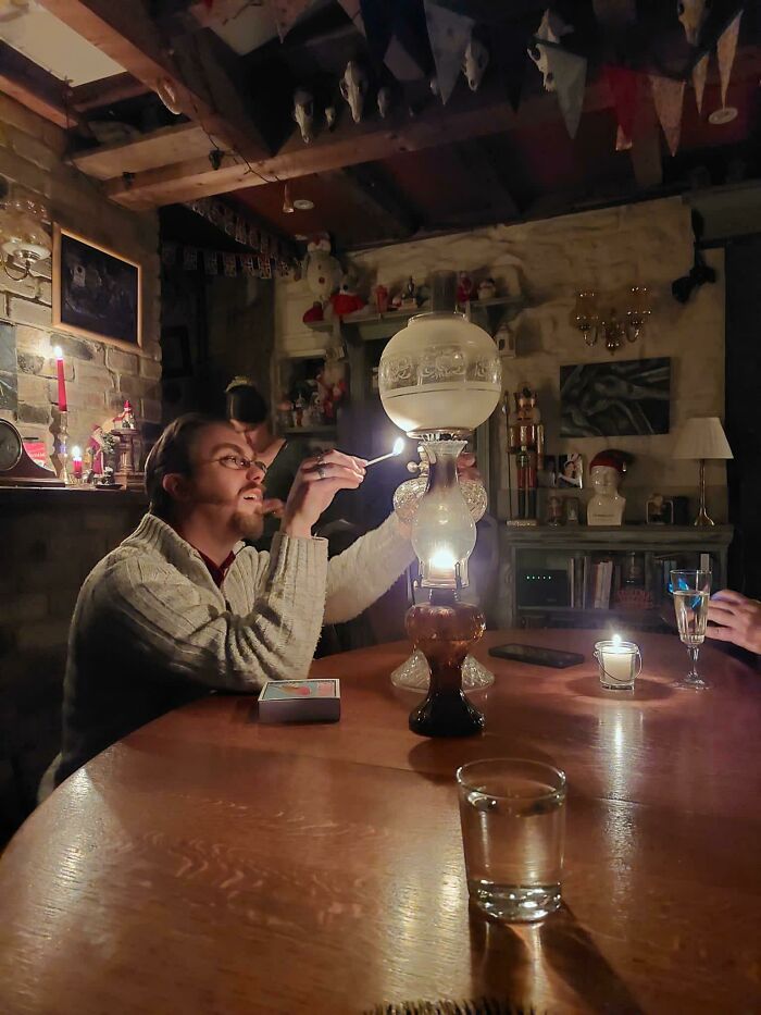 A Friend Lighting His Lamp After A Power Cut