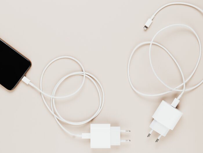 Two phone chargers on a table 